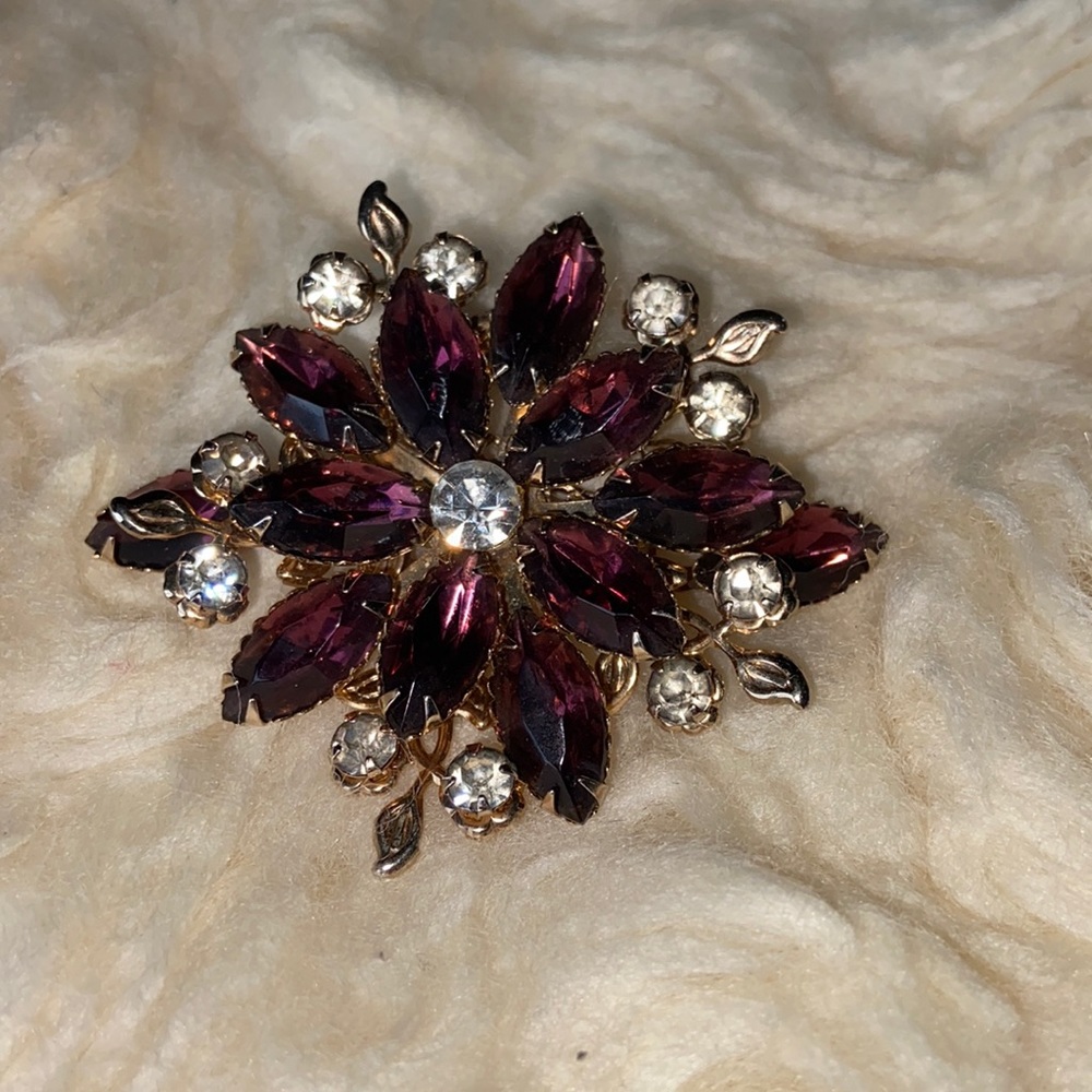 Faux amethyst and faux crystal brooch.